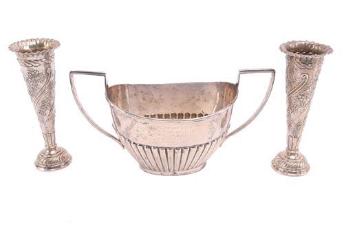 Lot 557 - A silver half-reeded sugar basin engraved with...