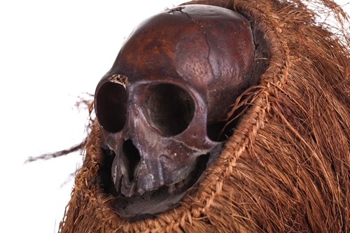 Lot 126 - A Cameroonian monkey skull fetish figure with...