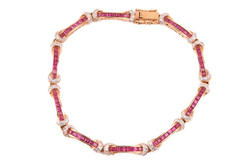 Lot 198 - A ruby and diamond line bracelet, each link of...