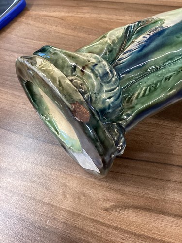 Lot 244 - A pair of earthenware winking cat candlesticks,...