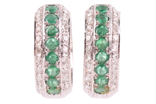 Lot 80 - A pair of emerald and diamond 'huggy' hoop...