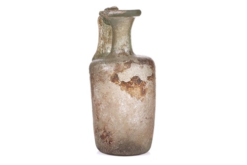 Lot 261 - A Roman glass oil ewer of slightly...