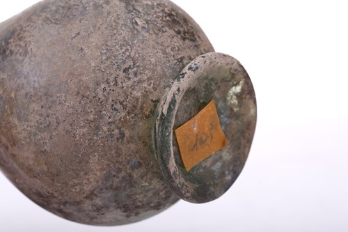 Lot 262 - A Roman glass inverted baluster flask with a...