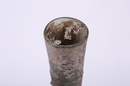 Lot 262 - A Roman glass inverted baluster flask with a...