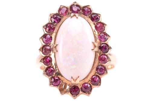 Lot 290 - An opal and ruby cluster ring, consisting of...