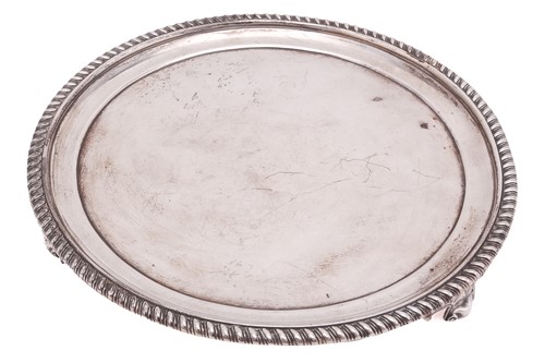 Lot 329 - A George III circular silver  waiter, London...