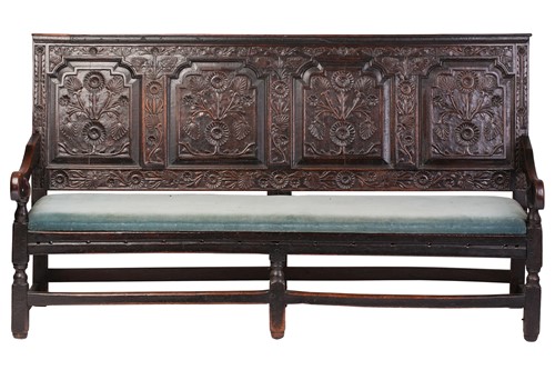 Lot 167 - An 18th century, oak settle with carved panel...