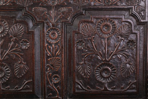 Lot 167 - An 18th century, oak settle with carved panel...
