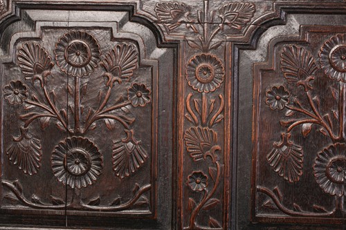 Lot 167 - An 18th century, oak settle with carved panel...