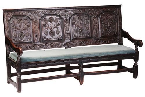 Lot 167 - An 18th century, oak settle with carved panel...