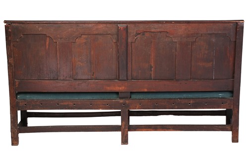 Lot 167 - An 18th century, oak settle with carved panel...