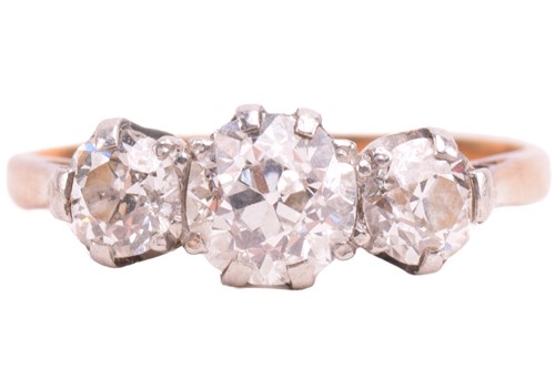 Lot 248 - A diamond three-stone ring, set with a trio of...