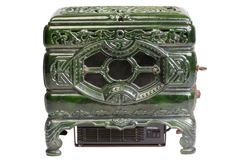 Lot 138 - A Faure Revin 'Mah Jong' green enamelled stove,...