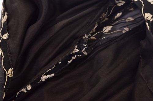 Lot 103 - Christian Dior; a black and embroidered long...