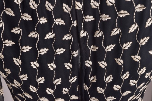 Lot 103 - Christian Dior; a black and embroidered long...