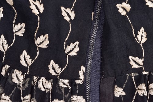 Lot 103 - Christian Dior; a black and embroidered long...