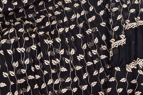 Lot 103 - Christian Dior; a black and embroidered long...