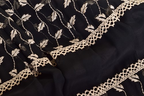Lot 103 - Christian Dior; a black and embroidered long...