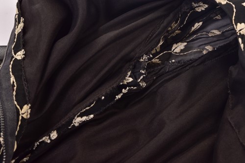 Lot 103 - Christian Dior; a black and embroidered long...