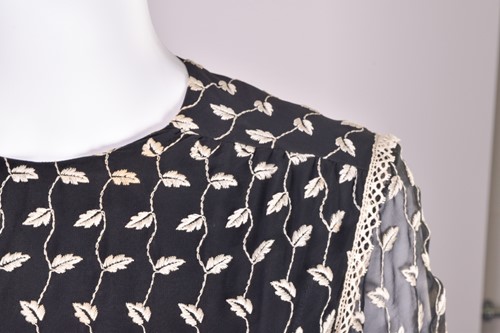 Lot 103 - Christian Dior; a black and embroidered long...
