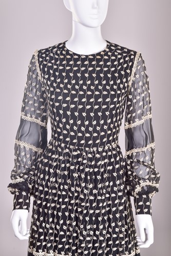 Lot 103 - Christian Dior; a black and embroidered long...