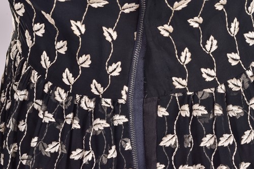 Lot 103 - Christian Dior; a black and embroidered long...