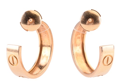 Lot 53 - A pair of Cartier 'Love' earrings, each of...
