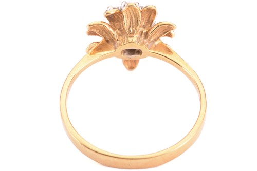 Lot 153 - A diamond flower ring, set with a central...