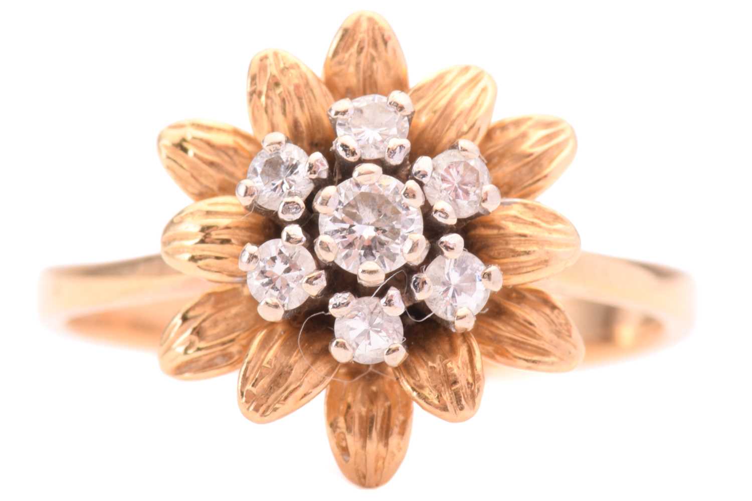 Lot 153 - A diamond flower ring, set with a central...