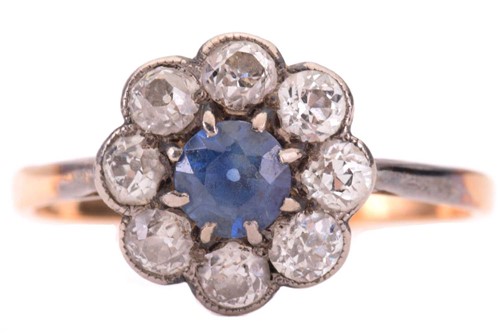 Lot 285 - A sapphire and diamond cluster ring, the...