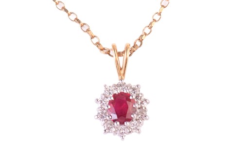 Lot 45 - A ruby and diamond cluster pendant, the...