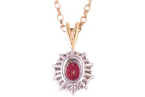 Lot 45 - A ruby and diamond cluster pendant, the...