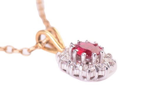 Lot 45 - A ruby and diamond cluster pendant, the...