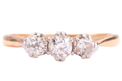 Lot 95 - A diamond three-stone ring, set with a trio of...