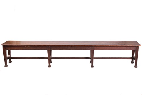 Lot 135 - A long oak college/mess hall form stool, late...