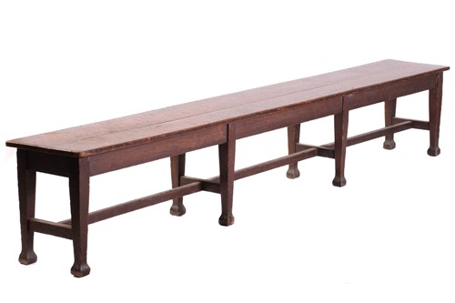 Lot 135 - A long oak college/mess hall form stool, late...