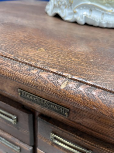 Lot 145 - An "ADDRESSOGRAPH" modular oak flight of...
