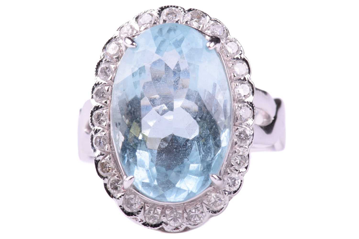 Lot 24 - An aquamarine and diamond cluster ring, set...