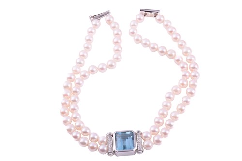 Lot 211 - An aquamarine, diamond and cultured pearl...