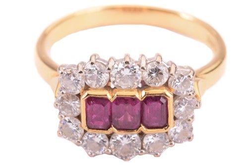 Lot 39 - A Ruby and diamond set cluster ring, featuring...
