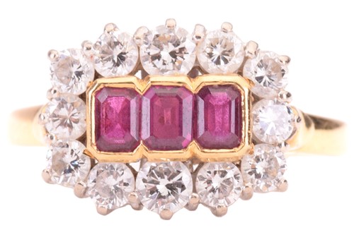 Lot 39 - A Ruby and diamond set cluster ring, featuring...
