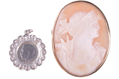 Lot 276 - A shell cameo brooch depicting a profile of a...