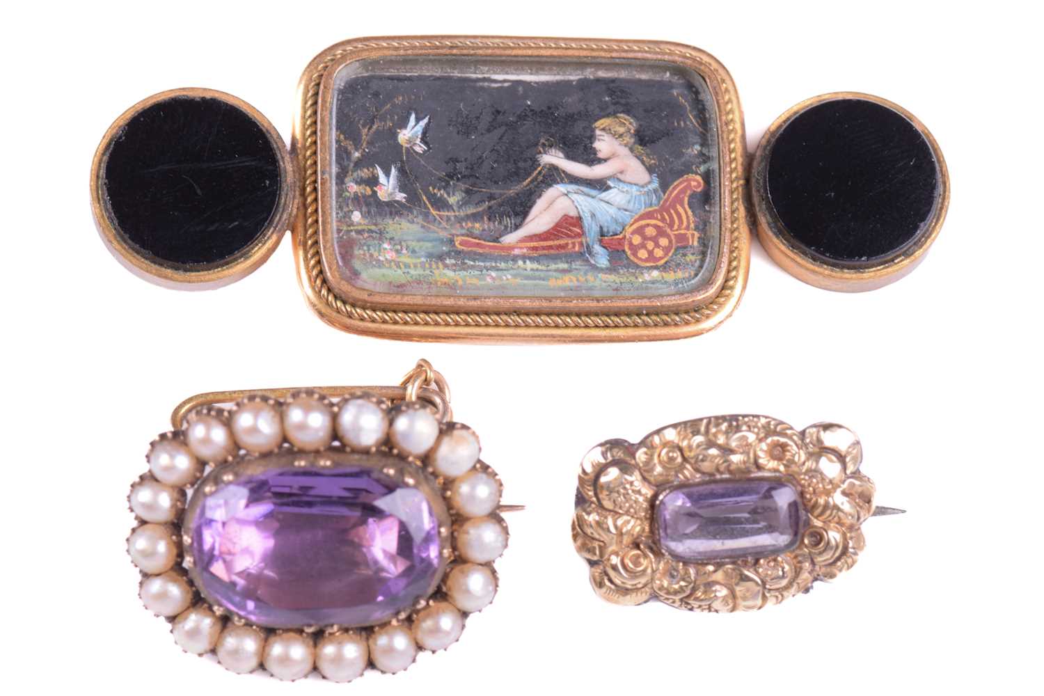 Lot 239 - Two amethyst fichu pins and a micro portrait...