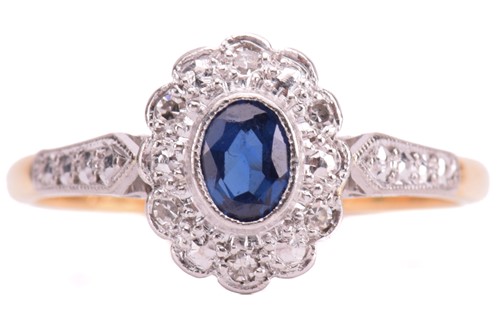 Lot 92 - A sapphire and diamond cluster ring, set with...