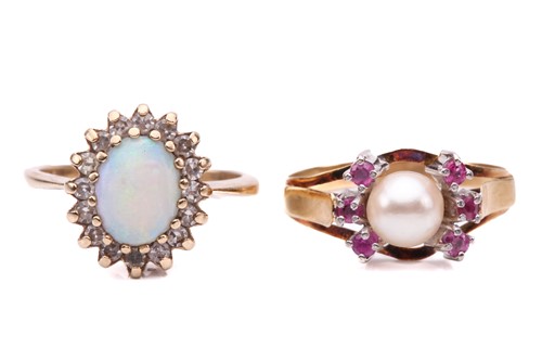 Lot 142 - An opal and diamond cluster ring, set with a...