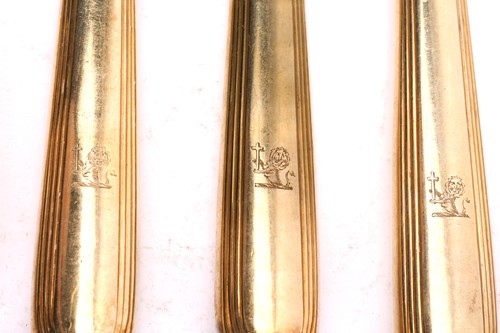 Lot 498 - A set of eighteen William IV silver gilt...
