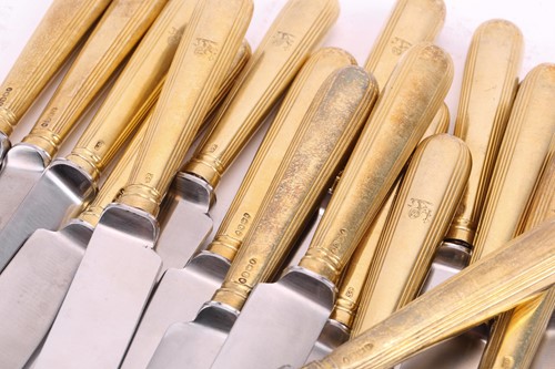 Lot 498 - A set of eighteen William IV silver gilt...