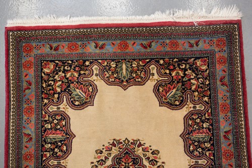 Lot 155 - An ivory ground Kerman strip runner with three...