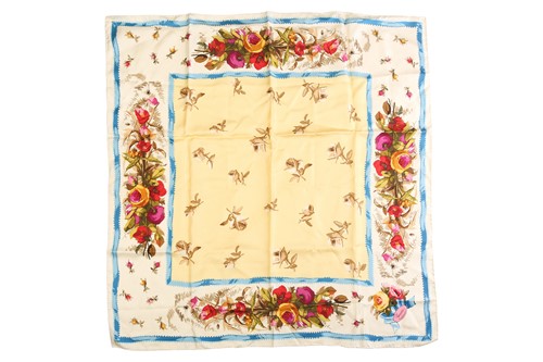 Lot 131 - Gucci - a floral silk square scarf in pale...