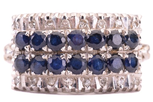 Lot 157 - A sapphire and diamond four-row half hoop ring,...